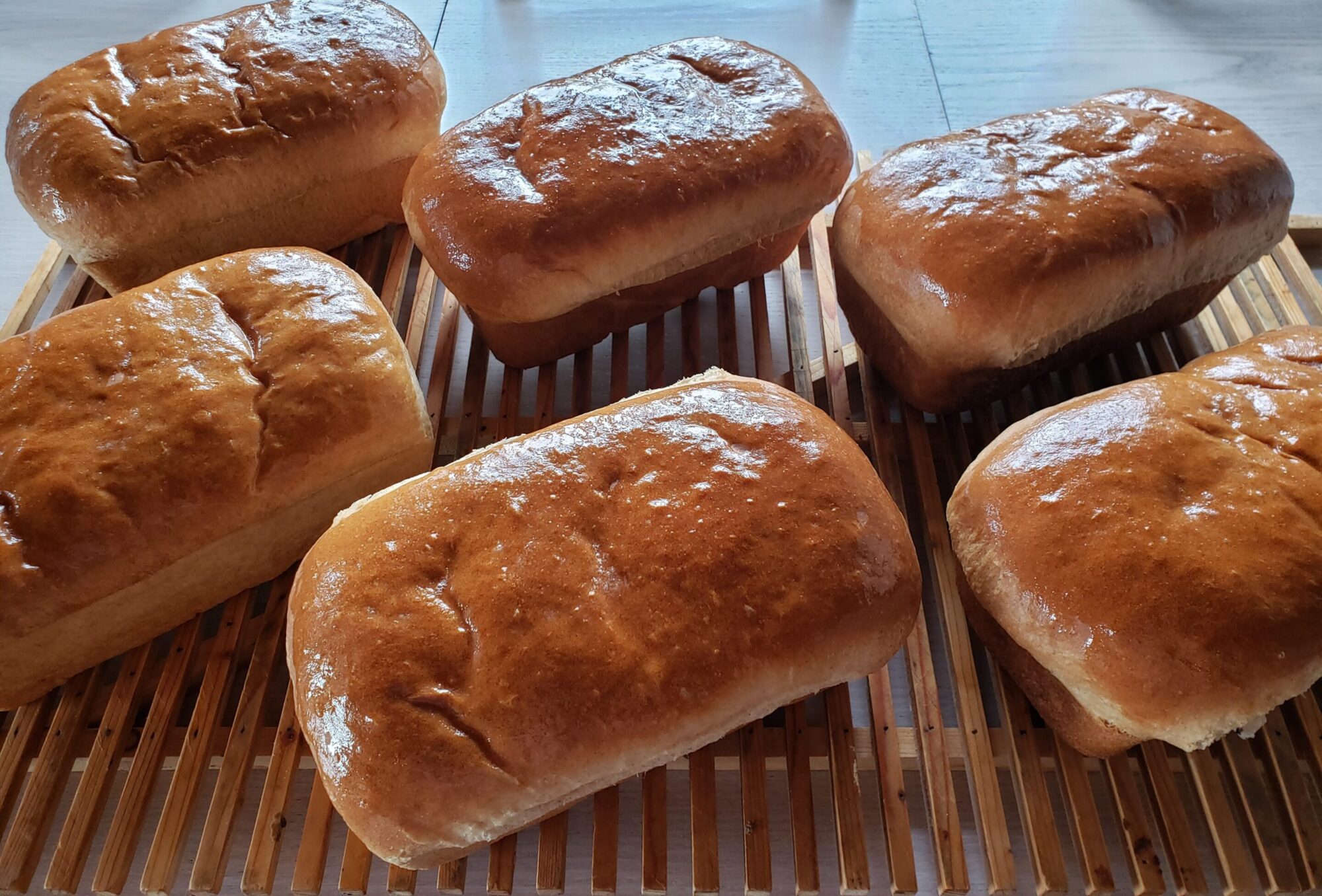 A close up of several baked goods on a grill