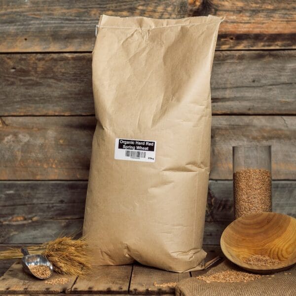 A bag of flour sitting on top of a wooden table.