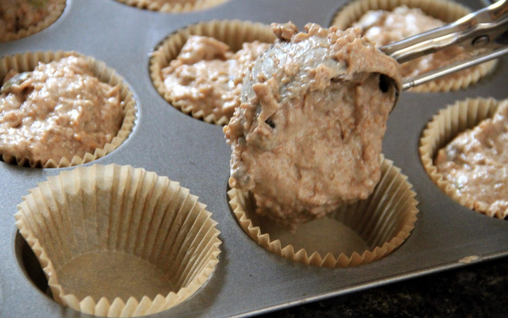 A muffin tin with some food in it